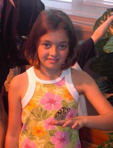 Me at 10 years old, holding a butterfly at the Milwaukee Public Museum.